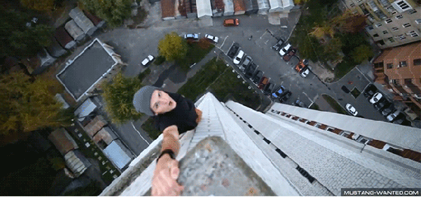 Guy Hanging Off The Edge Of Structures