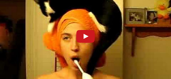 Lady Performs Morning Routine With Cat On Head
