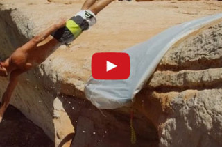 Would You Ride A Slip N Slide Off A 50-Ft Cliff?