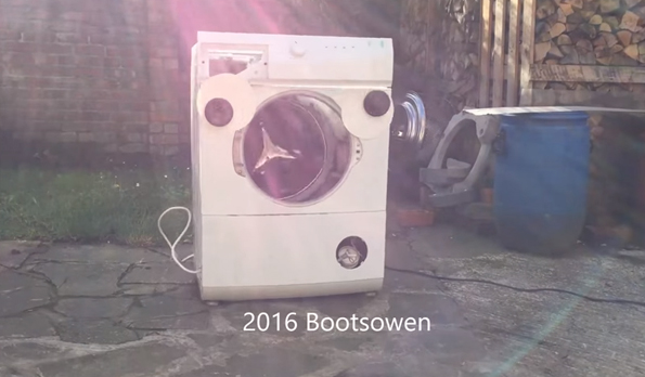 A Washing Machine With Googly Eyes Gets The Brick Treatment