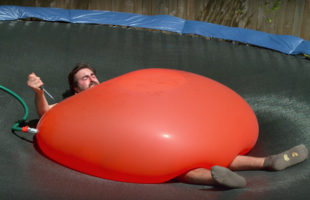 Watch This Guy Pop A Giant Water Balloon On Himself In Slo-Motion