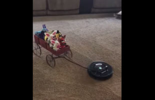 Watch A Roomba Take A Wagon Full Of Toys For A Ride