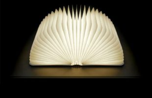 A multi-functional portable lamp hidden in a hard-cover book
