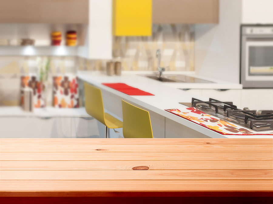 What To Consider Before Remodeling Your Home Kitchen, Background. Empty Textured Wooden Table And Kitchen Win