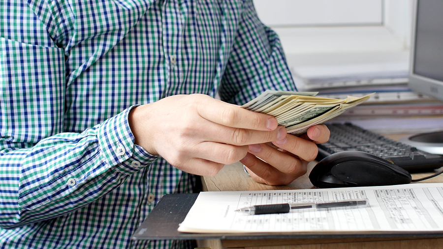 Male Hands Count Cash Money In The Office. Close Up Of Man Hands
