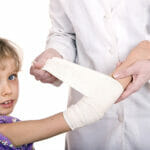 What You Need to Know About Becoming a Family Medicine Physician Doctor give first aid of child. Isolated.