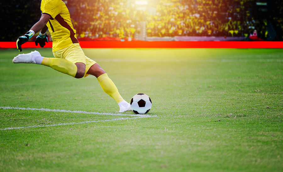 Soccer Or Football Player Standing With Ball On The Field For Ki
