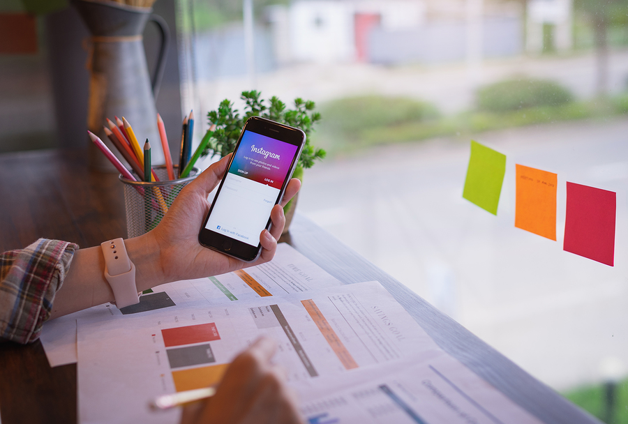 5 ways to Increase Instagram Followers for your business Chiang Mai, Thailand - July 13,2018: Woman Holding Huawei With I
