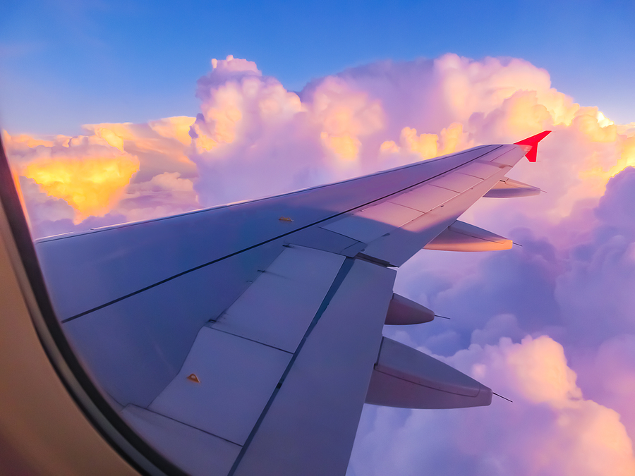 Key Tips for Your Florida Vacation View From An Airplane On A Blue Sky And White Clouds. Flying On