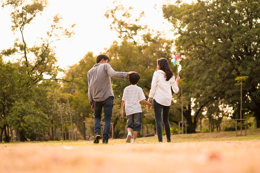 Stephanie Cox Hulsey's Advice for Raising Financially Responsible Children Scene From Behind Of Asian Happy Family Spend Time Together Walk