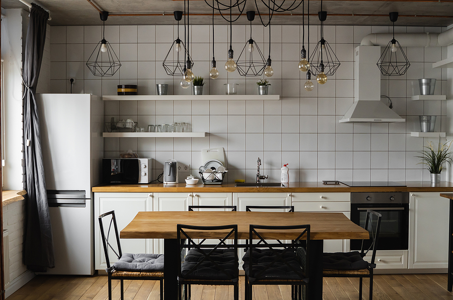 Things You Need To Consider About Your DIY Kitchen Design Modern, bright, clean, kitchen interior with stainless steel appliances in a luxury house. Kitchen in luxury mansion. Modern architecture contemporary, interior. Stylish kitchens interior with table.