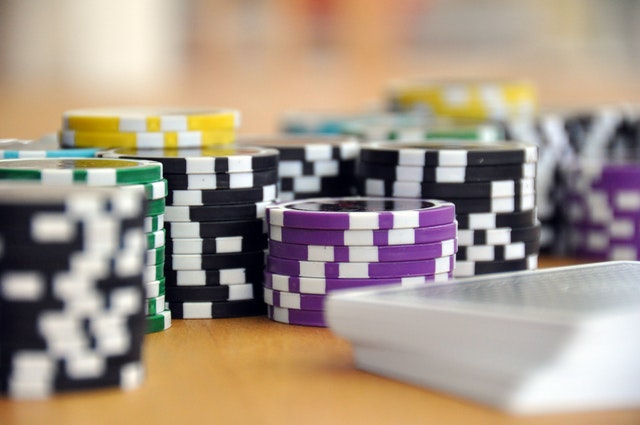 What Are Poker Bots & Why Are They Back in Trend? blue-green-and-purple-poker-chips-39856