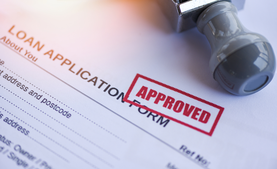 Loan approval / financial loan application form for lender and borrower for help investment bank estate concept money