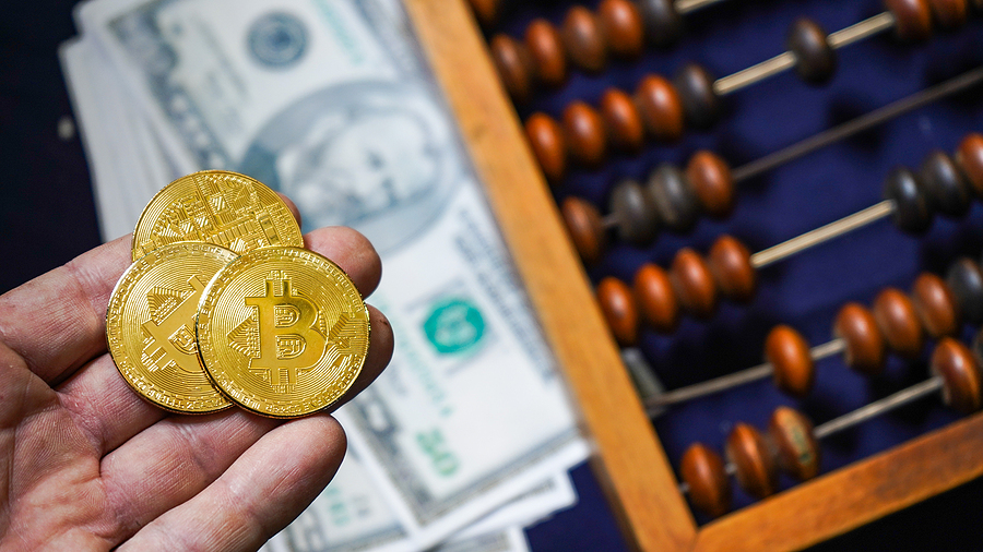 Why are Bitcoins so Highly Valued bitcoin Bitcoins on the background of dollars. Golden Bitcoins. Symbolic coins of bitcoin on banknotes . Exchange bitcoin cash for a dollar. Bitcoins and classic abacus and symbol of new and old financial tool . Abacus used for counting, adding, and subtracting