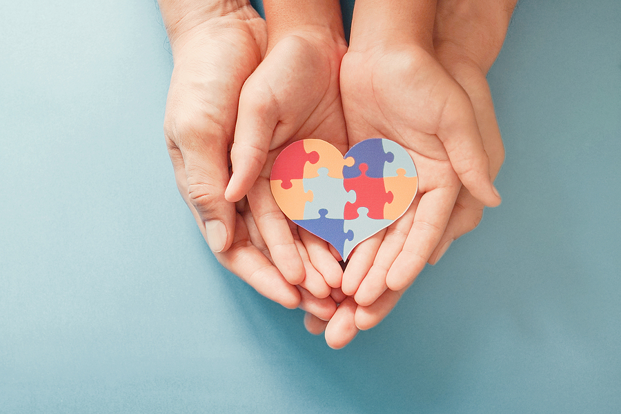 Tips to Prepare Yourself for a Meltdown of Your Child with Autism Adult And Chiild Hands Holding Jigsaw Puzzle Heart Shape, Autism