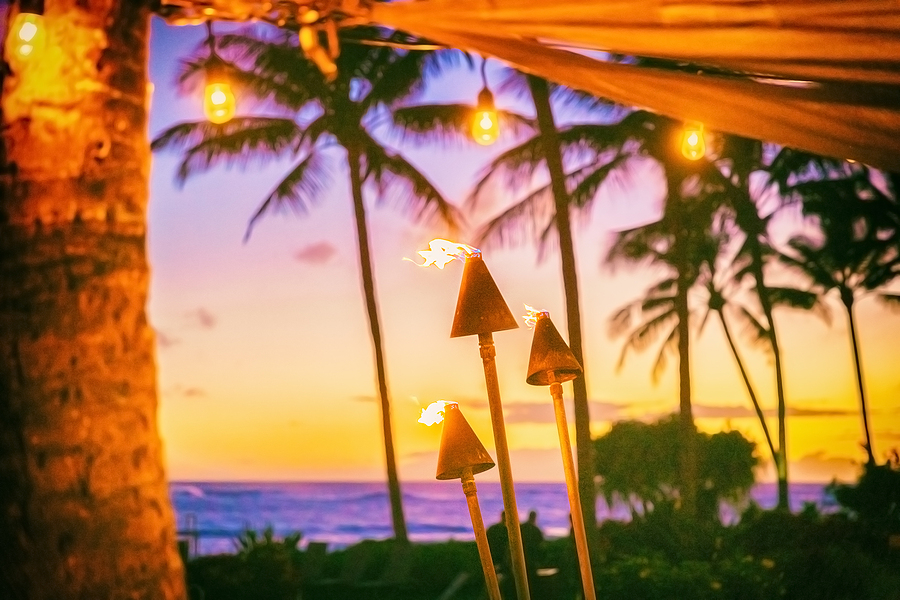 7 Quirky Facts On Hawaii You Need To Know Hawaii luau party with fire torches at sunset. Hawaiian icon, li