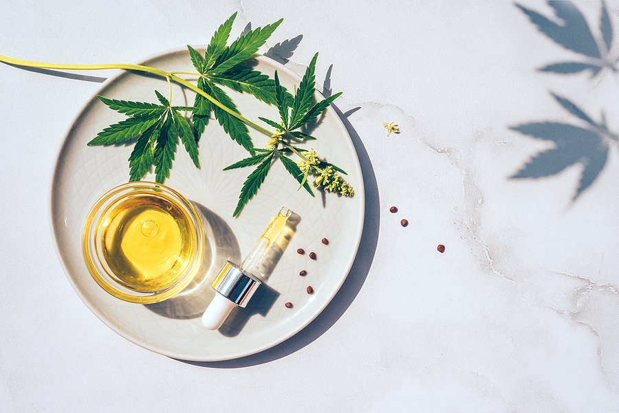 How To Choose The Correct CBD Vape Oil For Yourself? Medical marijuana cannabis cbd oil. CBD oil hemp products. Macro detail of dropper with CBD oil, cannabis live resin extraction on white background. Medical marijuana concept