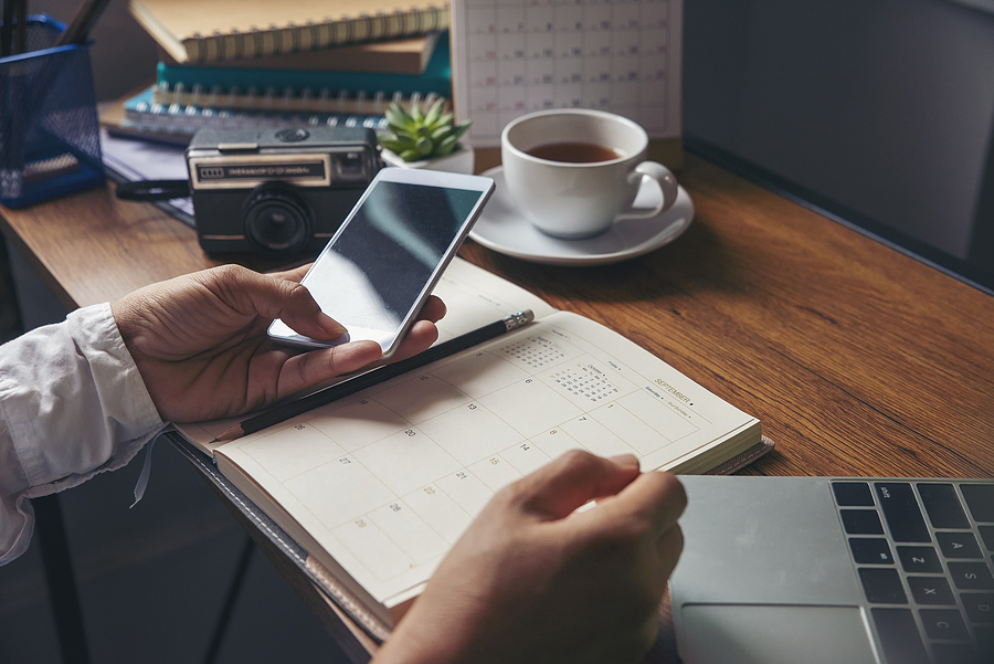 Night Before Exam: How to Deal With Stress? On 2020 Calendar book,Female'hand of planner writing daily appointment.Woman mark and noted schedule(holiday trip) on diary at office desk.Calendar reminder event for planner concept