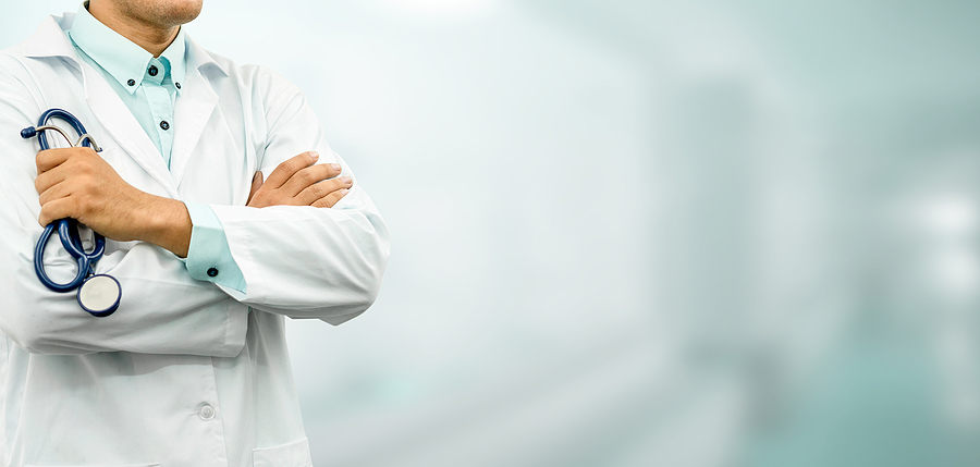 Male Doctor Standing In The Hospital Office.