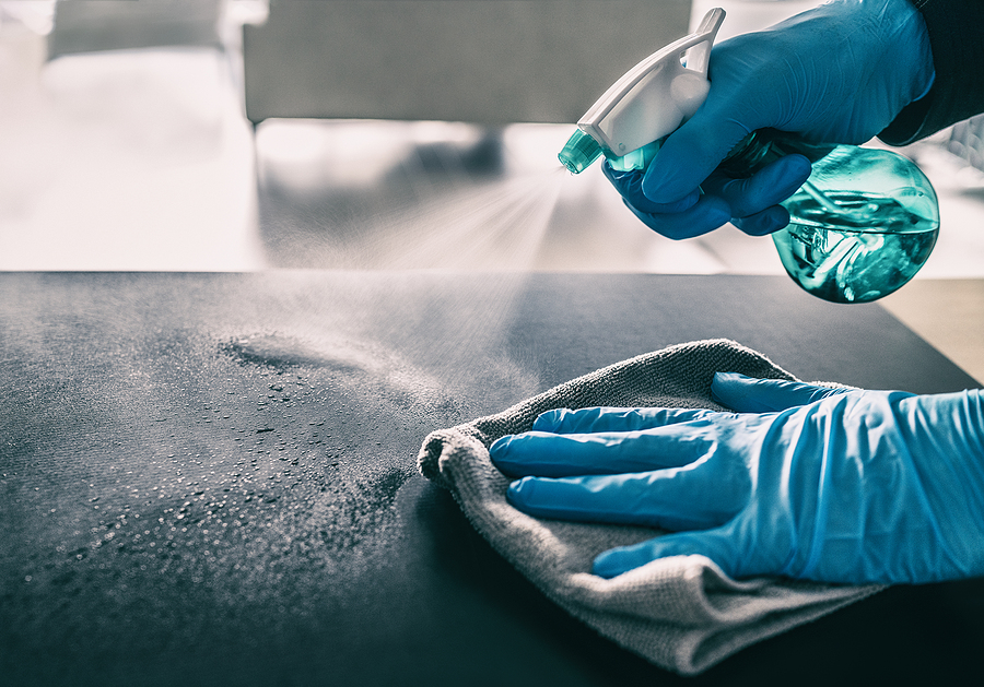 How to Disinfect All The Surfaces in Your house During the Pandemic Surface sanitizing against COVID-19 outbreak. Home cleaning spra