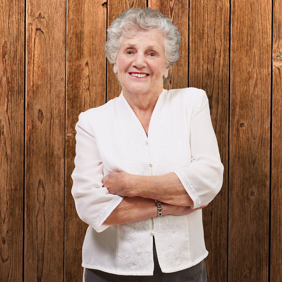 Advice for When You've Taken Over Care of A Parent: Home and Health Tips portrait of an adorable senior woman standing against a wooden w