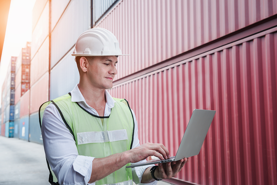 The Future of Freight: Emerging Career Paths in the Transportation Industry for Students Container Shipping Logistics Engineering of Import/Export Transportation Industry, Transport Engineer is Controlling Management Containers Box on Laptop at Port Ship Loading Dock. Industrial Shipping