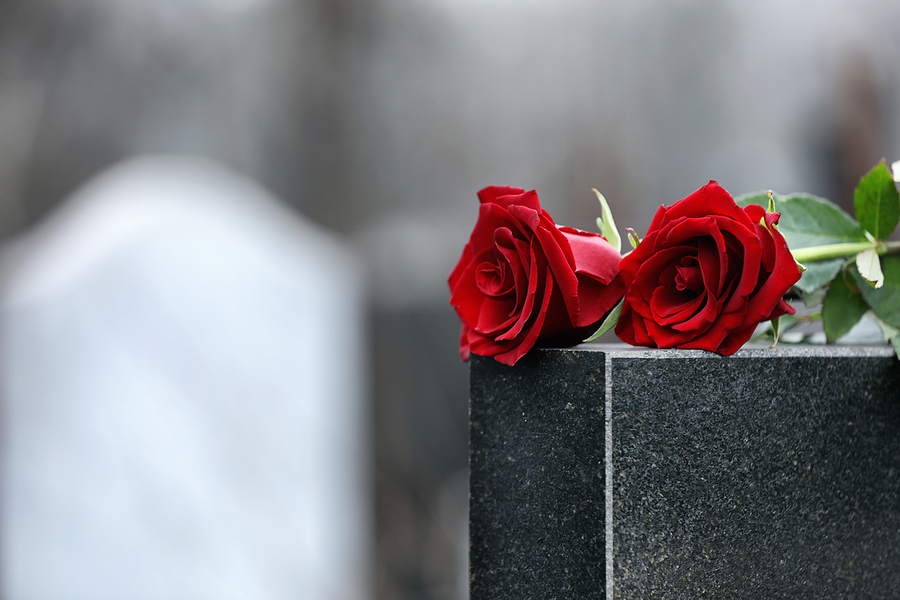 The Benefits of Using Technology in Funeral Services Red Roses On Black Granite Tombstone Outdoors, Space For Text. F