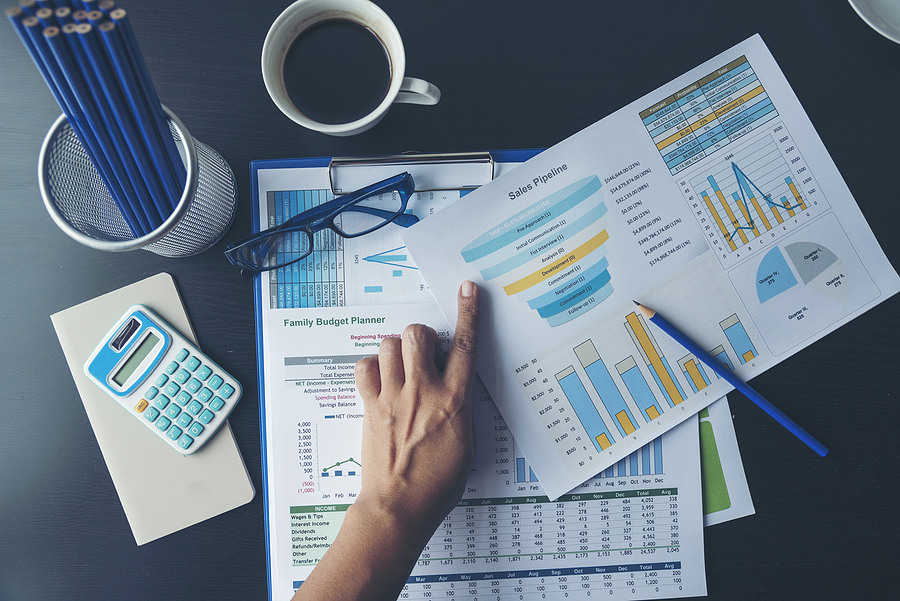 The importance of data quality in companies Excel Spreadsheet stats graph analytics data. Accountant hands holding Financial Document Trading Information with excel file. Finance statistic report analyze business graph, chart,database,report.