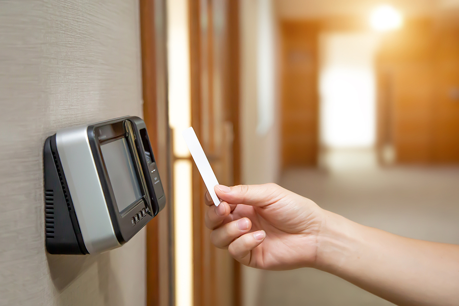 Why you need to keep track of your employee Attendance Office Man Using The Id Card To Scan At The Access Control Syste