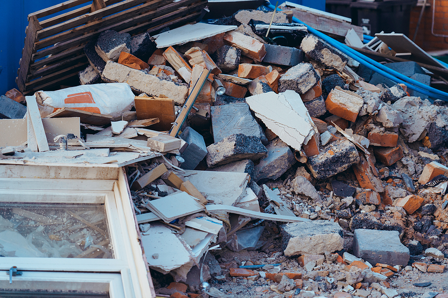 A Pile Of Construction Waste Near Private House. Building Rubble