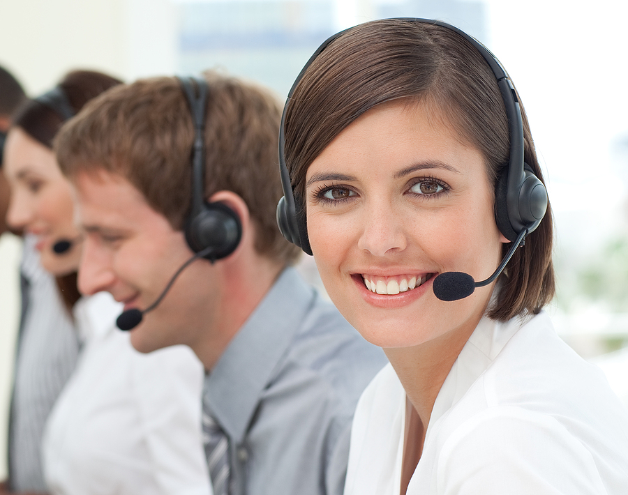 How to Improve Customer Service? Unique Customer Service Strategies Female customer service agent with headset on in a call center
