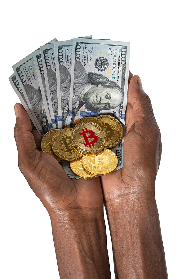 Bitcoin Traders Abound: What Are The Top Fiat Currencies Used? bitcoin African woman hands holding a stack of bitcoins and dollars,