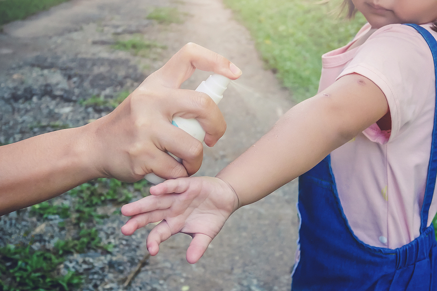 Does Insect Repellent work? Pros and Cons Hand spraying insect or mosquito repellents on skin girl, mosquito repellent for babies, toddlers that will protect your children from mosquitoes and other insects