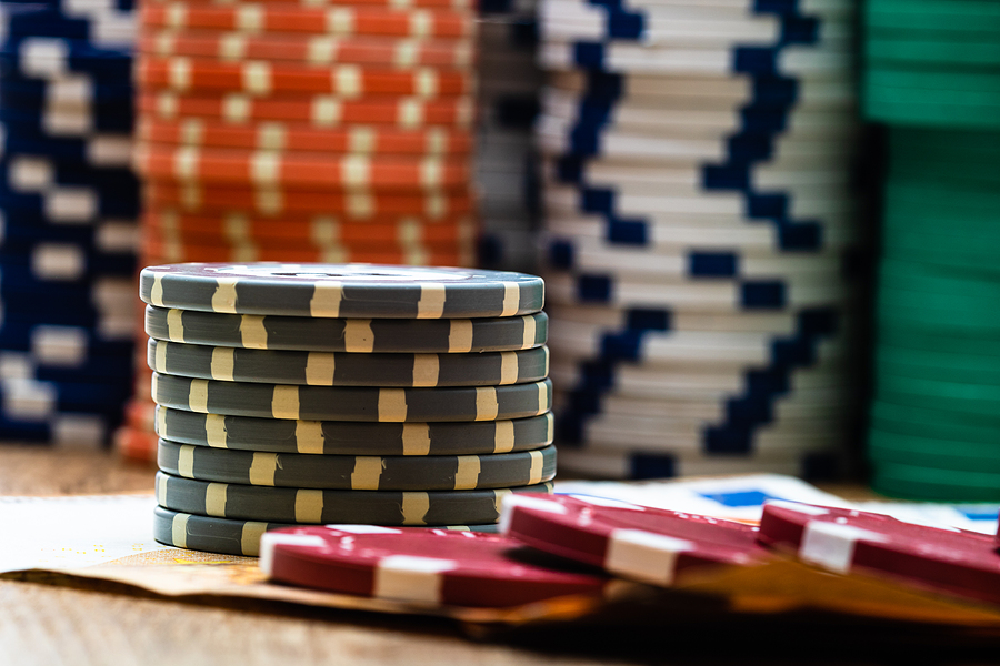 Poker casino chips and money close up. Casino concept, risk, chance, good luck or gambling. Detail of casino chips, EURO, US dollars