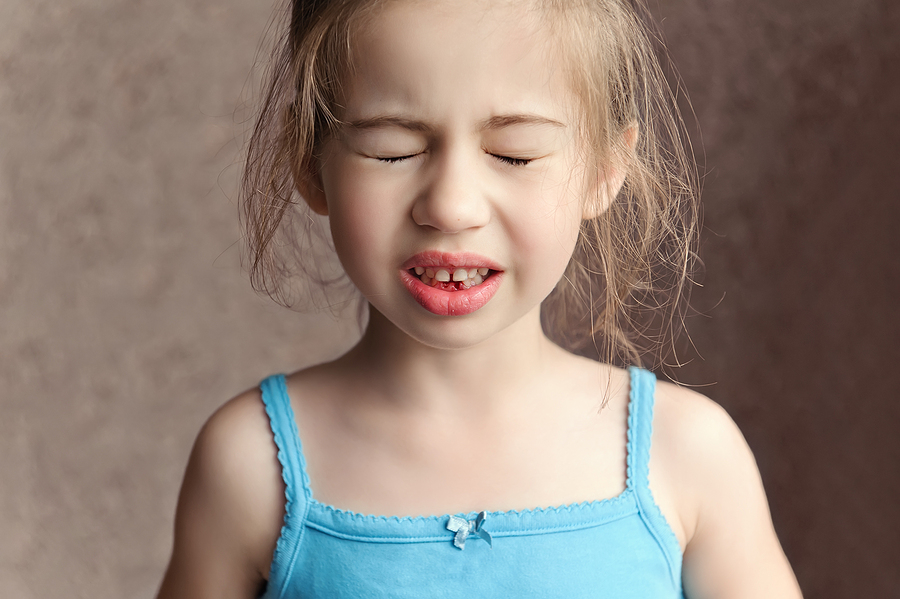 How To Tell If Your Kids Have Sensitive Gums Little Girl Squeezed Her Eyes In Pain, Blood On The Gums From Th
