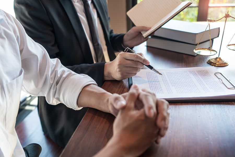 Male Notary lawyer or judge consult or discussing contract papers with Businessman client in office, Law and Legal services concept.