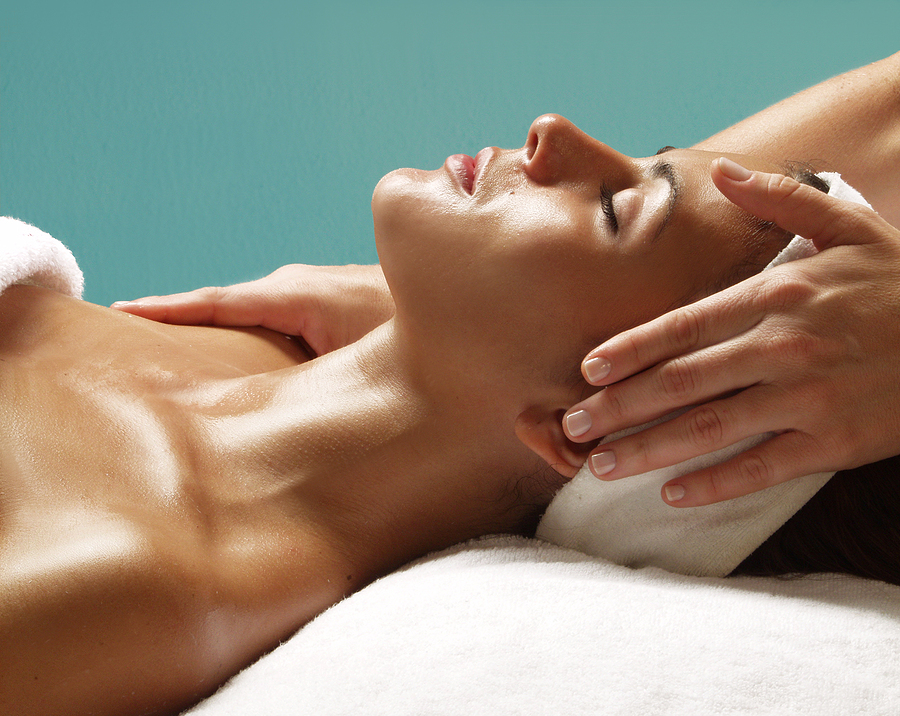 Why Opt For Facial Extraction Treatment To Get Rid of Acne Beautiful young woman getting a face treatment at beauty salon.
