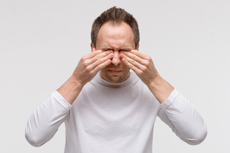 Close Up Of Man Has A Problem With Contact Lenses, Rubbing His S