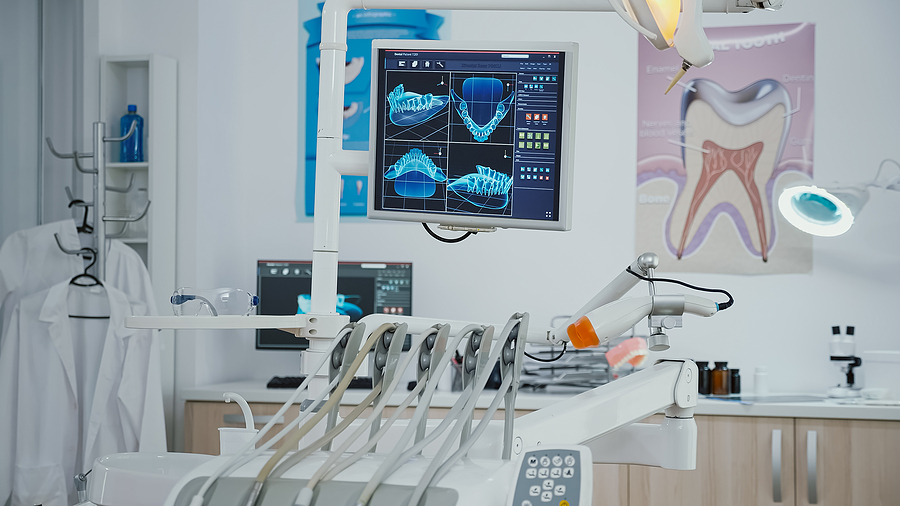 How To Choose The Right Dentist For Implants Close up of professional dental stomatology equipment in modern bright office, orthodontic drill prepared for medicine operation during dentistry appointment. Dentistry cabinet equipped dental tools