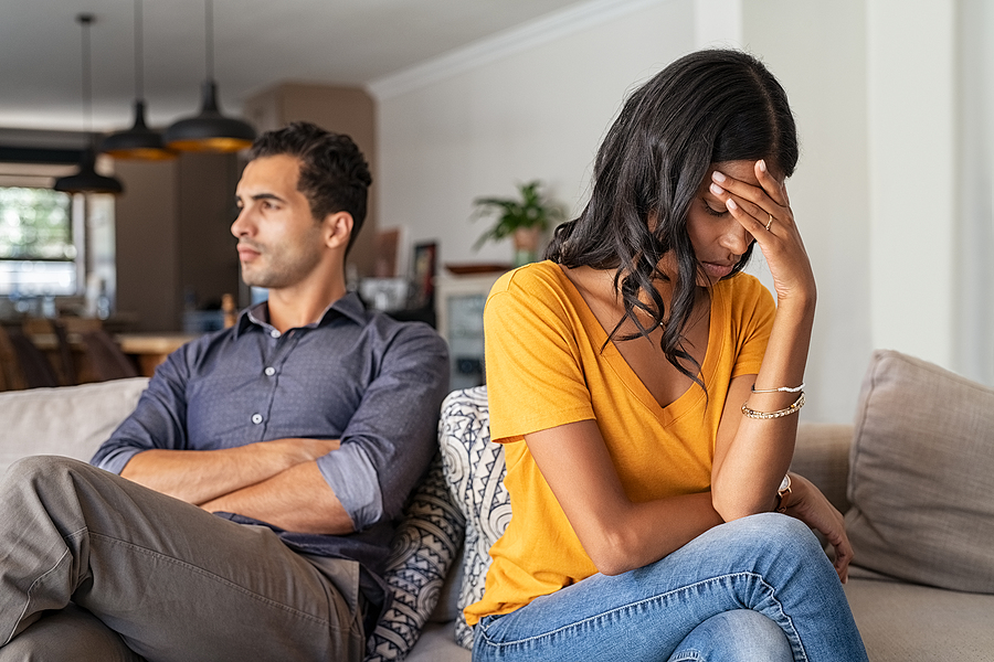 Maintain A Healthy Relationship and Stop Fighting With Your Partner how to stop fighting in a relationship Middle eastern young couple sitting on couch after a fight. Sad indian woman sitting with hand on head after quarrel with boyfriend at home. Angry couple ignoring each other, relationship troubles.