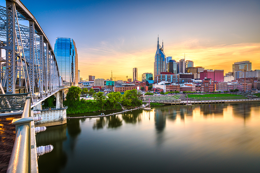 Top 5 Things to Do in Tennessee on a Family Trip Nashville, Tennessee, USA downtown city skyline at dusk on the Cumberland River.
