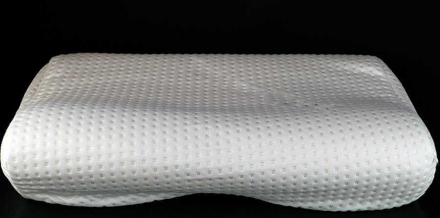 How To Choose A Memory Foam Pillow For Your Child? Orthopedic Pillow On A Black Background. Memory Foam Pillow.