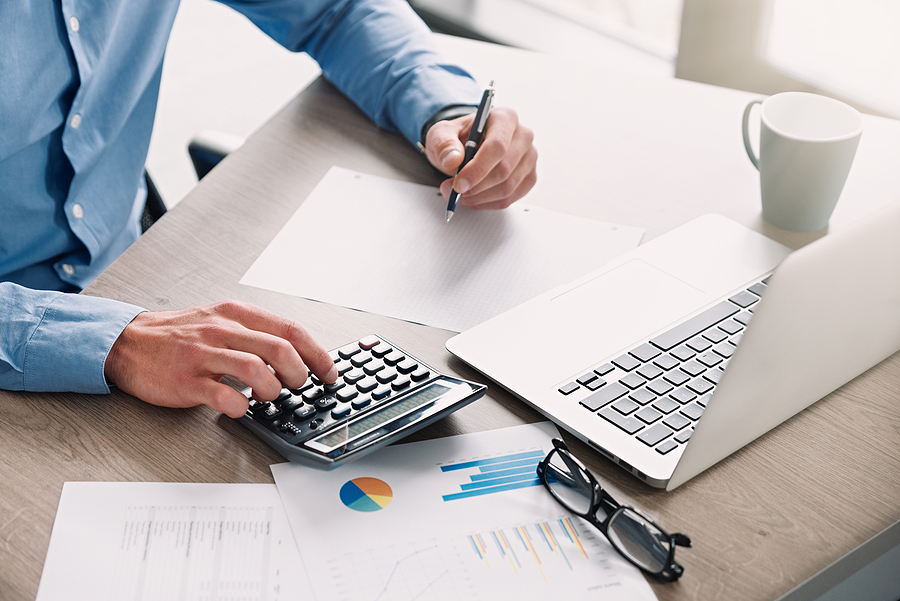 Revealed: Deloitte the most common destination for Russell Group alumni Businessman, accountant working in office. Bookkeeping concept