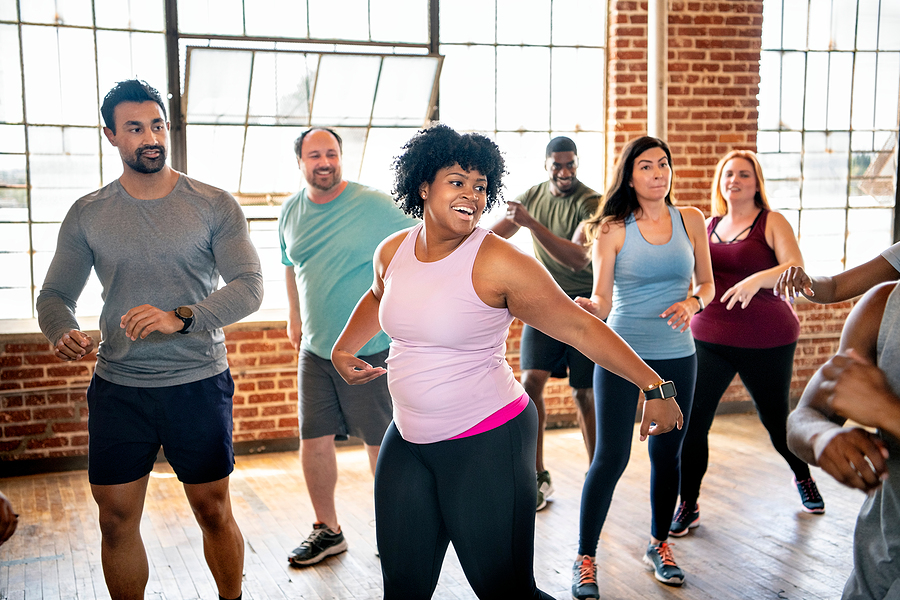 Dance Fitness & Hip-Hop Aerobics: Fun Cardio with Style Diverse people in an active dance class