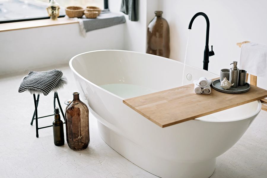 9 Soothing Ways to Relax in a Bath White Bathtub Fills With Foam Water In A Modern Apartment With S