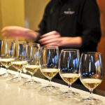 A Guide to Wine Tasting: How to Choose the Perfect Wine For Yourself wine tasting Row of white wine glasses in winery tasting event
