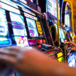 American Casino Slot Machines Players. Line of One Handed Bandits Machines. Entertainment Industry.