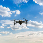 Why the U11MINI 4K Drone Is the Father's Day Gift You Didn’t Know He Needed Drone copter flying with digital camera. Drone with high resolution digital camera. Flying camera take a photo and video. The drone with professional camera takes pictures of the misty mountains