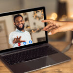 6 Ways to Spark Your Long Distance Relationship Long Distance Relationship. African american couple having online virtual date, reaching hands to each other to webcam in videochat with videoconferencing app window. Remote Dating During Pandemic.
