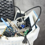 Wired for Success: How ECER Inc. Leads the Charge in E-Waste Management on the East Coast Electronics waste bin concept / Garbage electrical waste ready for recycling , Old devices E-waste disposal management reuse recycle and recovery